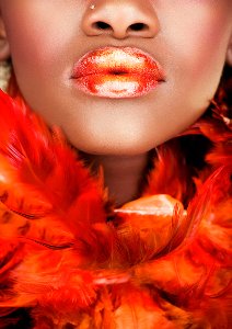 Beauty with red feather boa 